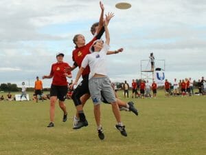 Roth going for the disc against two defenders. Seattle Riot's Miranda Roth goes up for a disc against two defenders.